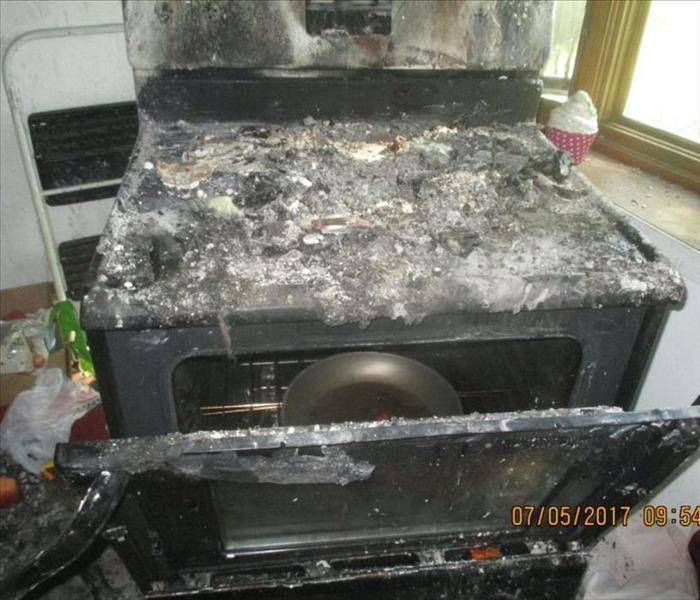 stove covered in fire debris